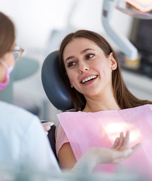 Dentist talking to dental patient