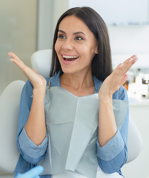 Woman showing off smile after cosmetic dentistry