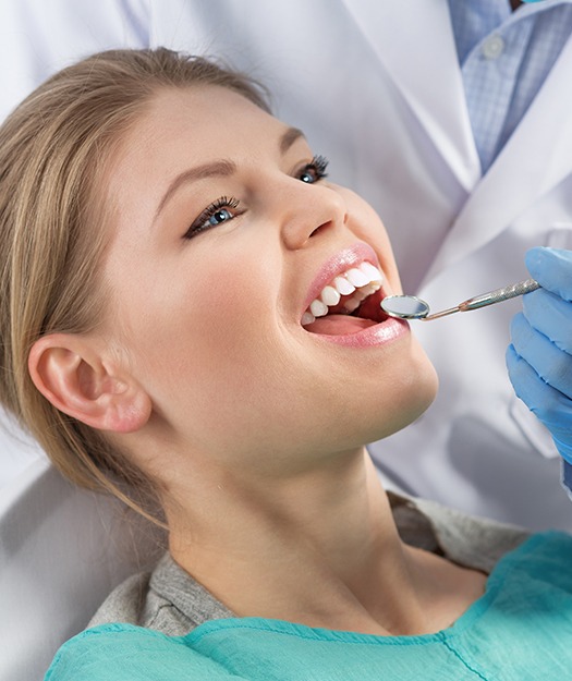 Woman receiving preventive dental exam