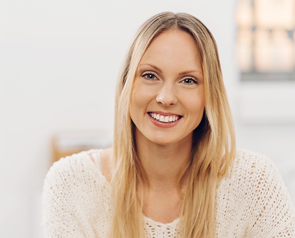 Woman smiling after periodontal disease treatment