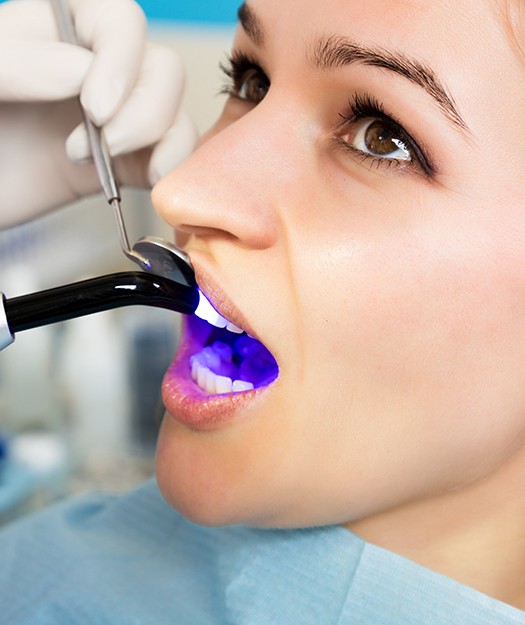 Woman receiving cosmetic dental bonding treatment