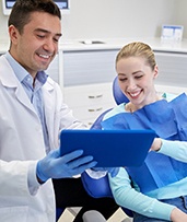 dentist and patient discussing the cost of dental implants in Pewaukee 