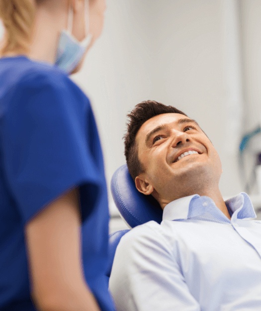 Man in chair smiling