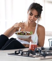 Woman eating salad in Pewaukee