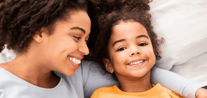 Mother and child smiling after children's dentistry visit