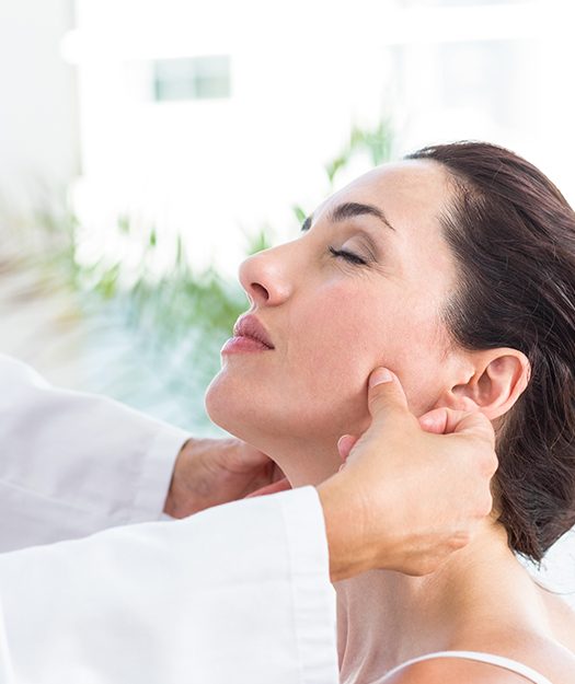 Woman receiving muscular and physical therapy evaluation