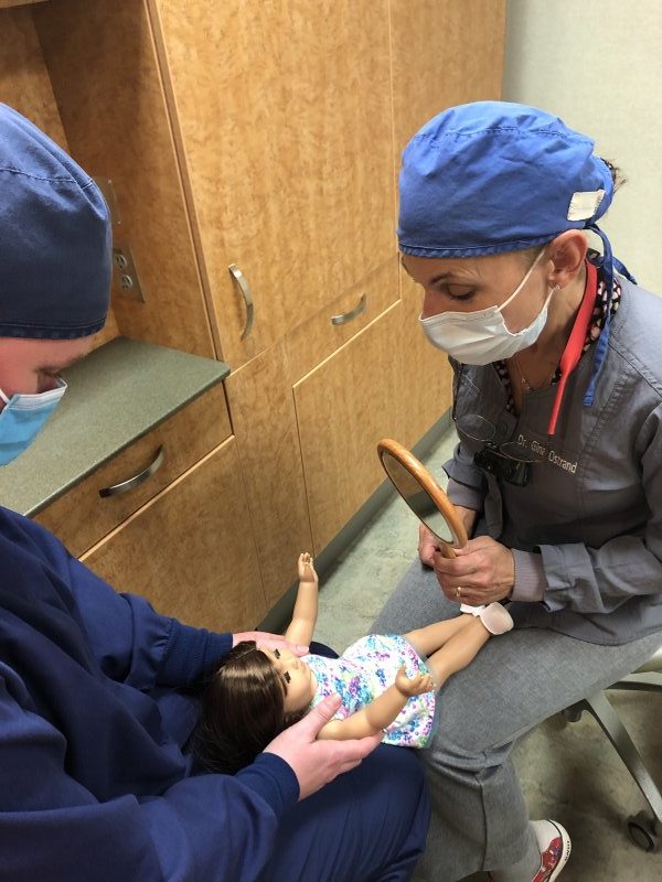 Dentist Pewaukee doing mock dental exam