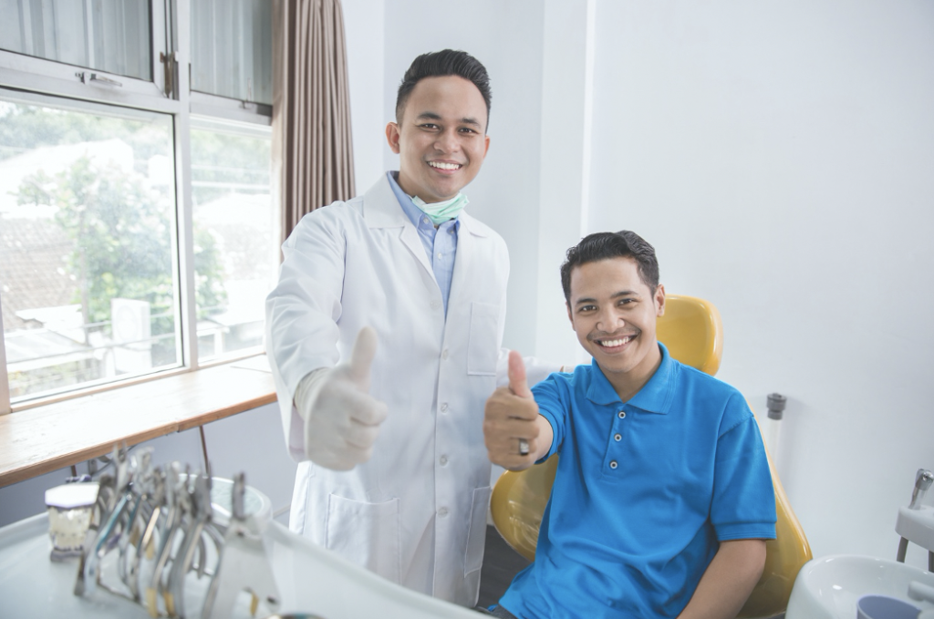 dentist and patient smiling 